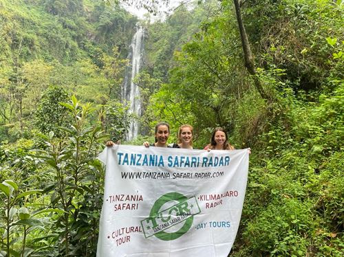 Beautiful Materuni waterfall cascading down lush green rocks near Moshi town